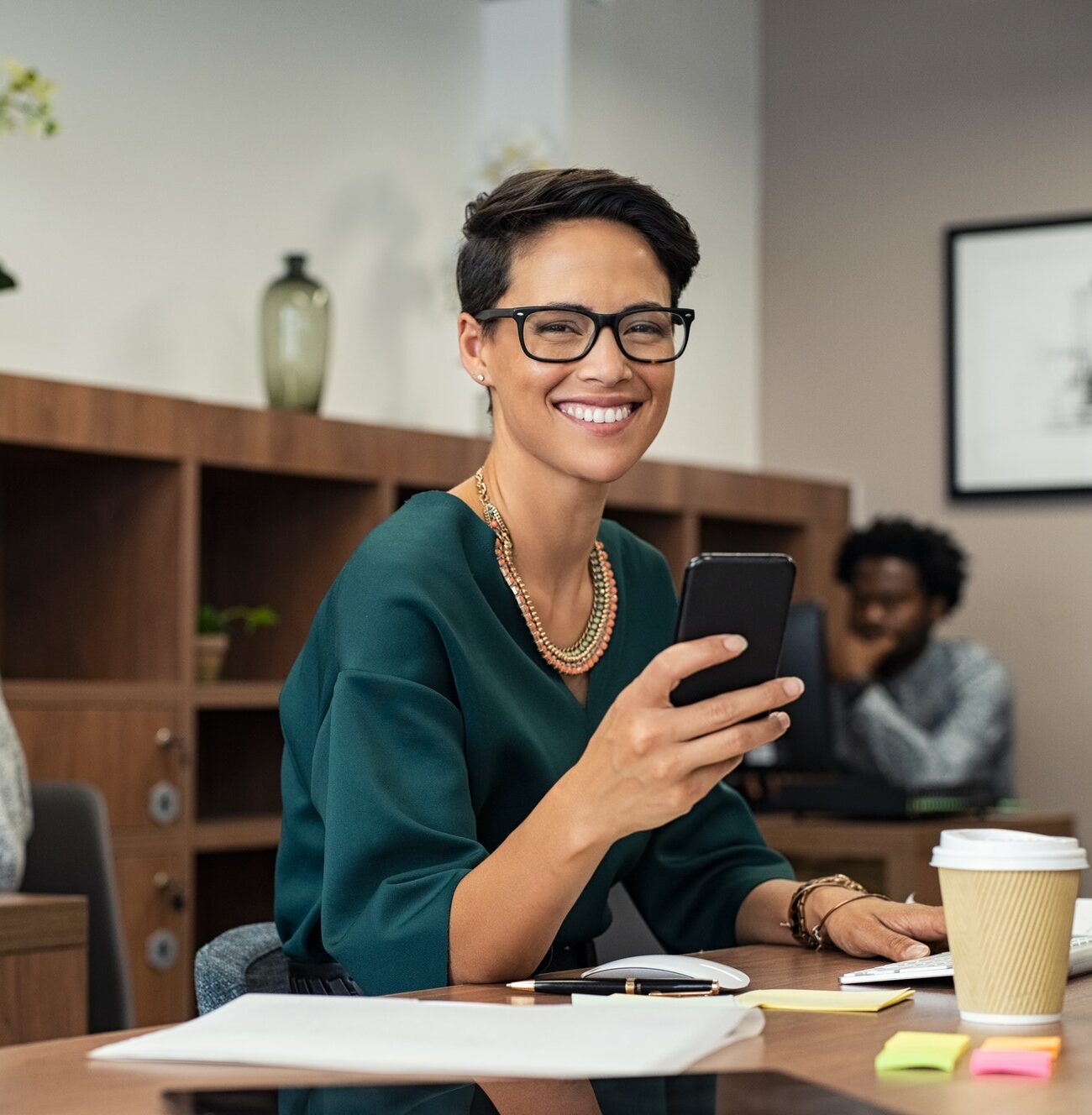 Stylish business woman using smartphone